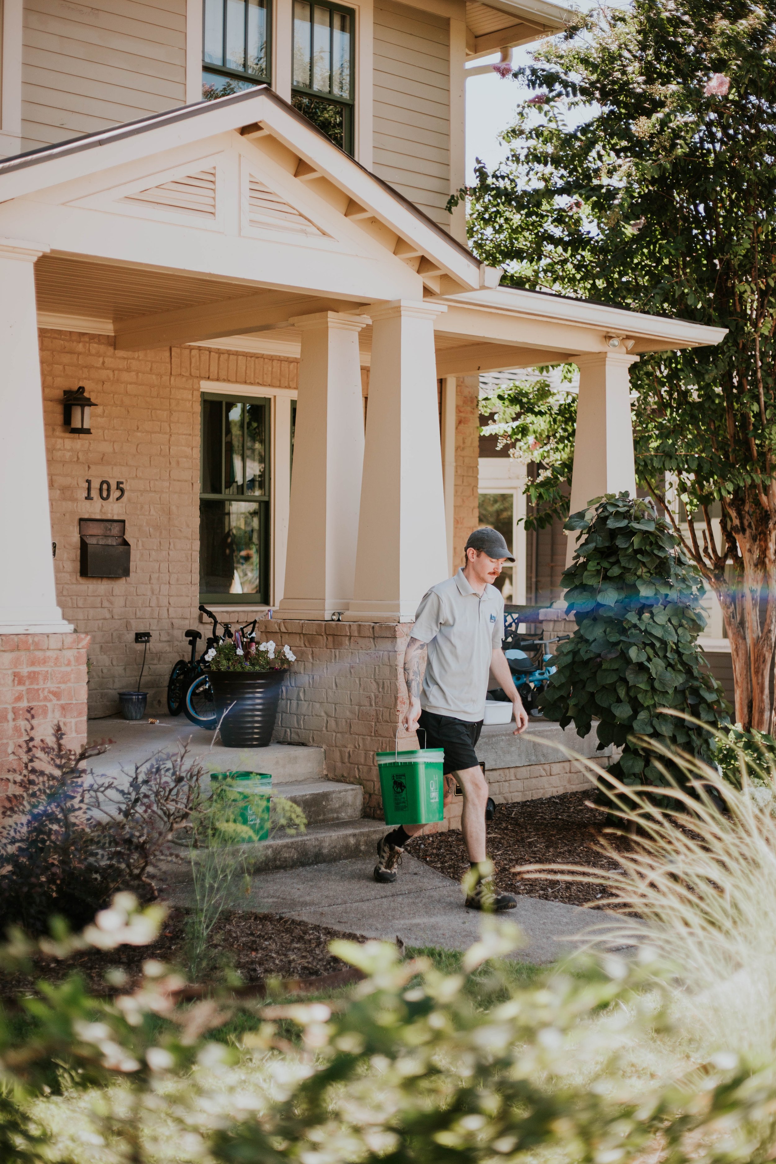 Compost Nashville driver collecting a curbside bin
